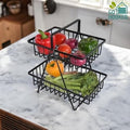 GoHooked black metal 2-tier fruit basket with Y-design, holding bell peppers, tomatoes, onions, broccoli, and yellow pepper.
