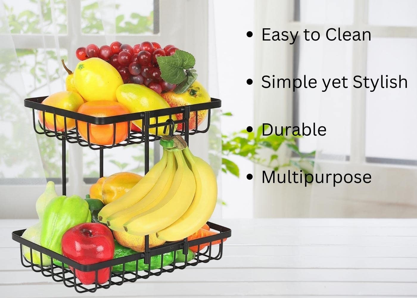 GoHooked black metal 2-tier fruit basket organizer filled with various fruits and vegetables on a white table.