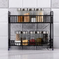 Go Hooked black 2-tier iron spice rack organizer filled with jars of spices and condiments.
