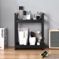 GoHooked black metal 2-tier standing organizer with wood handles, holding cosmetics and toiletries.