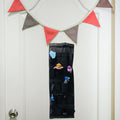 GoHooked black 20-pocket over-the-door organizer with clear pockets, holding cleaning supplies and toys.