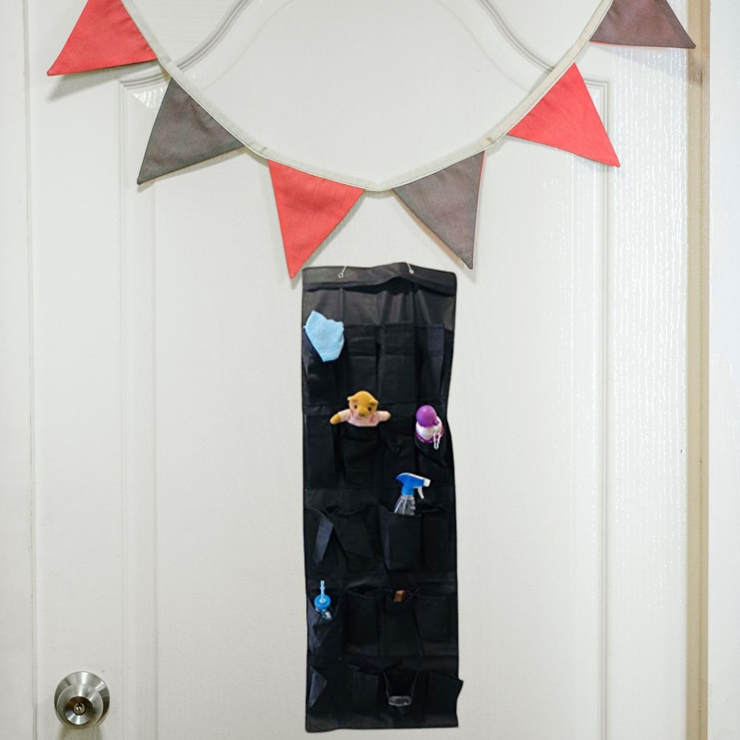 GoHooked black 20-pocket non-woven fabric over-the-door organizer with clear pockets, holding cleaning supplies and toys.