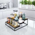 GoHooked black 3-tier iron countertop organizer rack with wood-look shelves, holding spice jars and canisters.