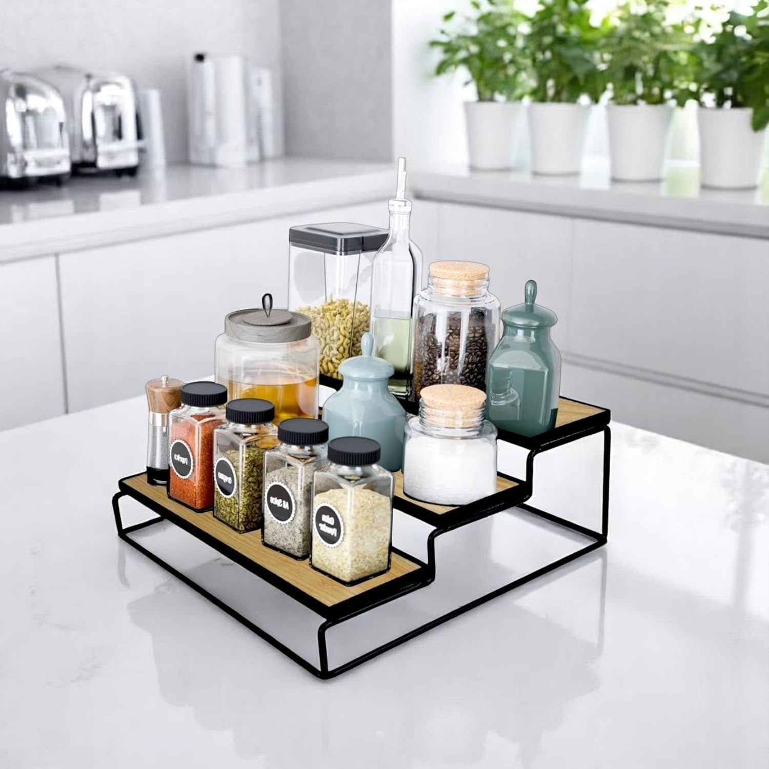 GoHooked black 3-tier iron countertop organizer rack with wood-look shelves, holding spice jars and canisters.