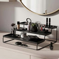 GoHooked black 3-tier metal countertop organizer shelf holding makeup and skincare products. Ideal for bathroom or vanity.