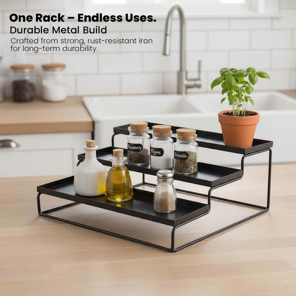 GoHooked black 3-tier metal spice rack organizer with spice jars, oil bottles, and a potted plant.