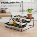 GoHooked black 3-tier metal spice rack organizer with spice jars, oil bottles, and a potted plant.
