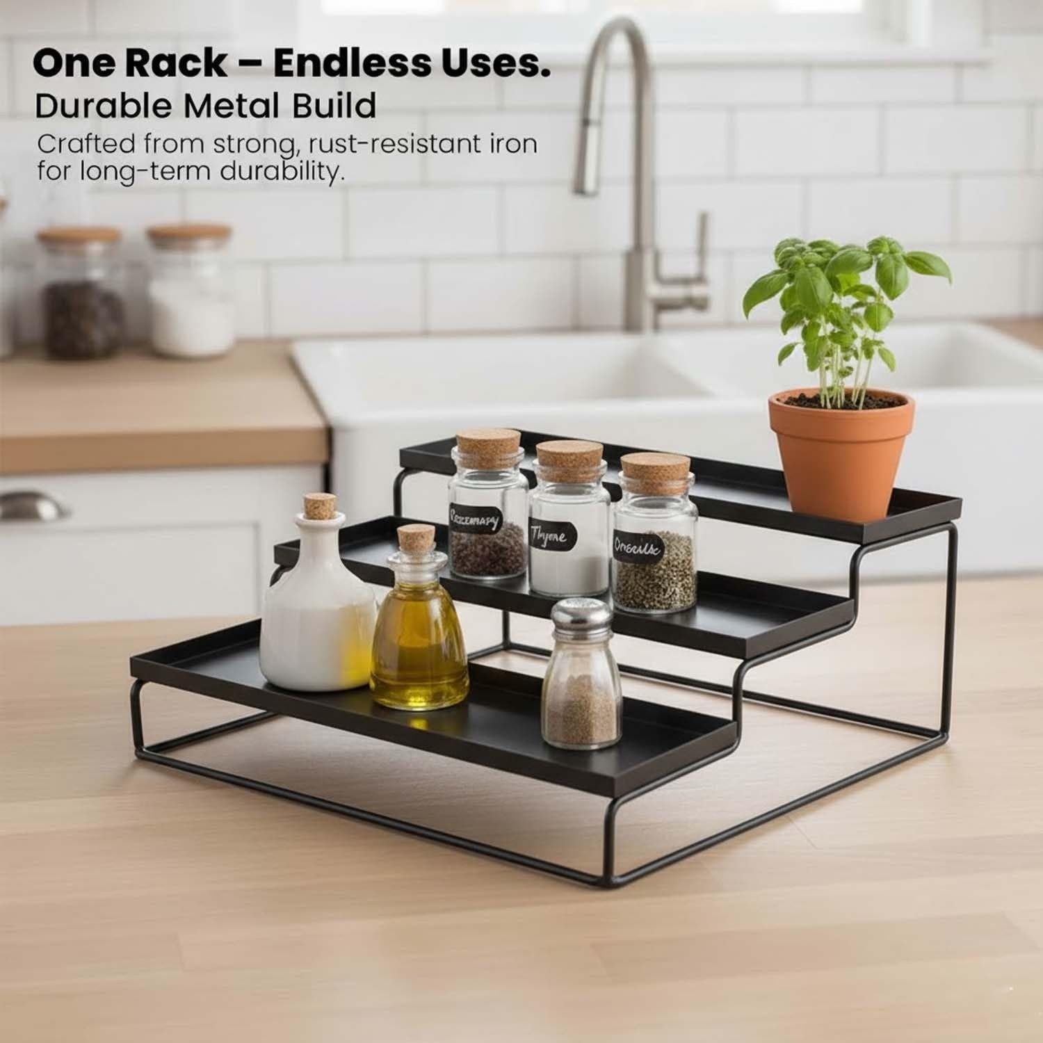 GoHooked black 3-tier metal spice rack organizer with spice jars, oil bottles, and a potted plant.