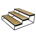 GoHooked black metal 3-tier step shelf organizer with wood-look shelves for spices, cosmetics, or bathroom essentials.