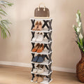 GoHooked 7-tier black and white plastic shoe rack with modern design, holding various shoes and a handbag.