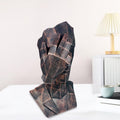 GoHooked abstract geometric polyresin showpiece in black copper finish, depicting a face covering eyes. Modern decor.