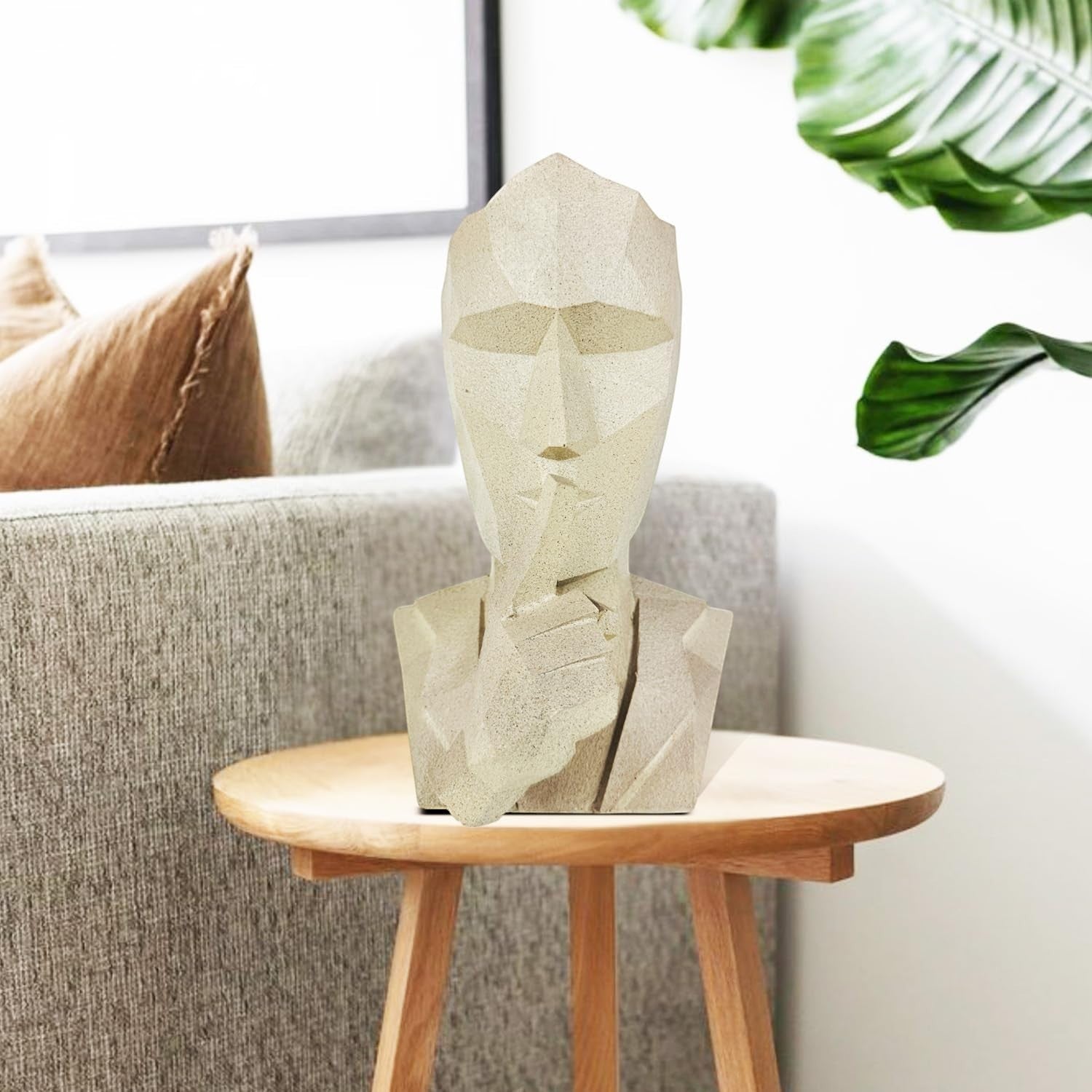 GoHooked abstract geometric polyresin showpiece in marble finish, depicting a face with a finger to its lips.