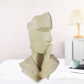 GoHooked abstract polyresin showpiece in marble finish, depicting a face with finger to lips. Modern geometric design.