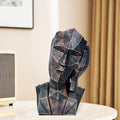 Go Hooked abstract geometric face statue in black copper finish, representing 'Hear No Evil'. Modern polyresin decor.