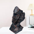GoHooked abstract geometric human face showpiece in black copper finish, representing 'Hear No Evil'. Polyresin statue for modern decor.
