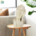 GoHooked abstract geometric face statue with marble finish, resting hand on cheek.
