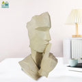 Go Hooked abstract geometric face statue in marble finish, a modern resin sculpture for home and office decor.