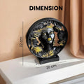 GoHooked black and gold polyresin African lady bust statue with palm leaf circular frame, 22 cm height.