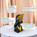 GoHooked black and gold polyresin bust of an African tribal lady wearing a masked crown, 25cm tall.