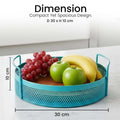 GoHooked aqua blue round metal storage tray with handles, perforated design, holding fruit. Ideal for home decor.
