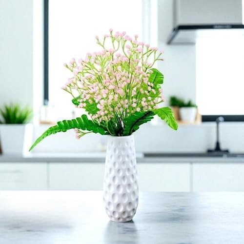 GoHooked light pink artificial baby's breath flowers in a white textured vase, with green foliage accents.