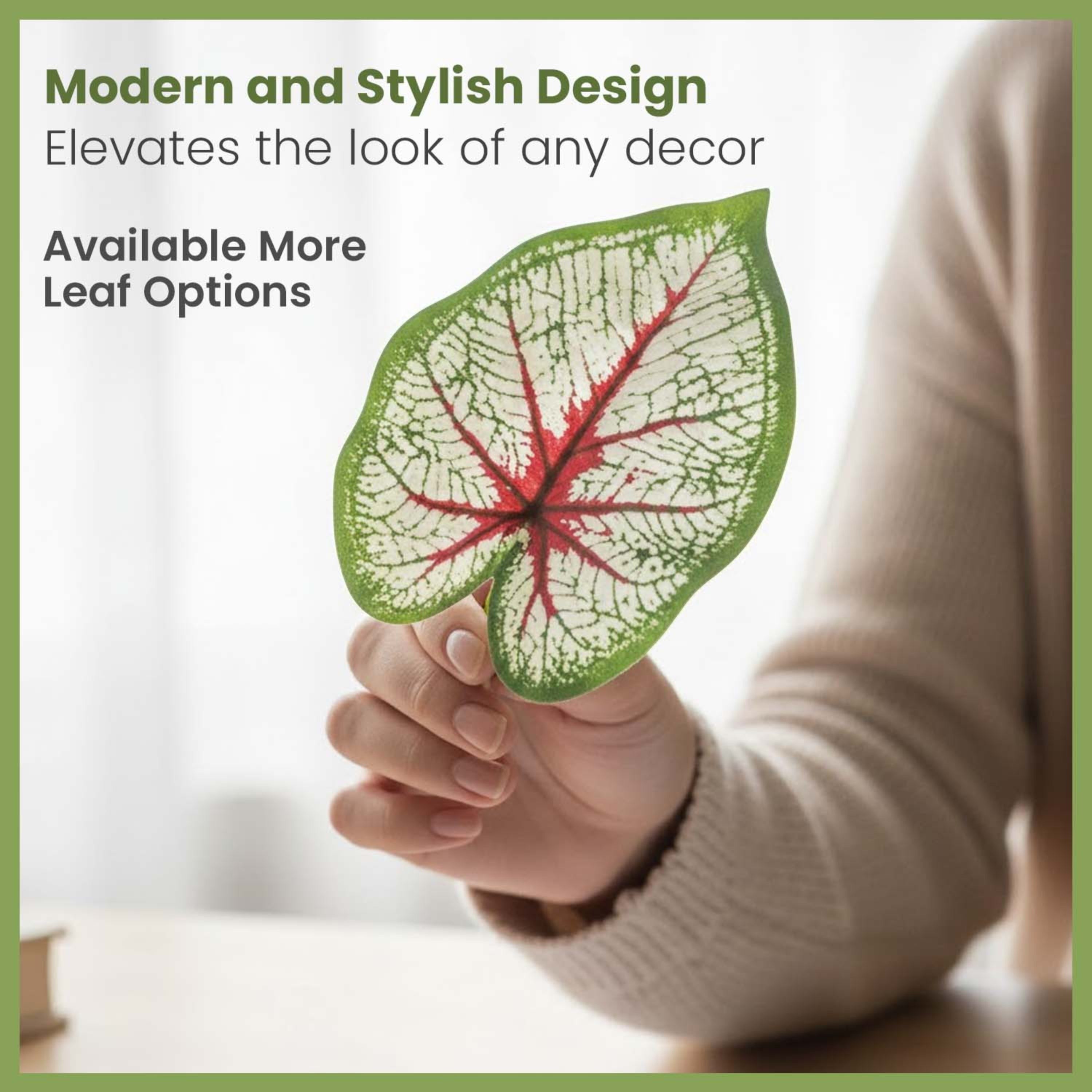 GoHooked artificial Caladium Bicolor leaf with white and green patterned foliage and red veins held by a hand