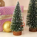 GoHooked 12-inch artificial Christmas tree with snow-tipped green branches and a wooden base.