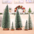 GoHooked green and white artificial Christmas trees with snow-dusted tips on wooden bases. Tabletop decor.
