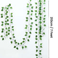 Go Hooked pack of 24 green arrowhead leaf artificial creepers, 7 ft each, made of plastic for home decor.