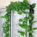 GoHooked green artificial arrowhead leaf creeper garland with yellow-green veins, 7 ft long, plastic material.