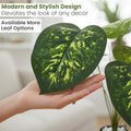 GoHooked artificial Dieffenbachia plant leaf with realistic green and yellow patterned texture held in a hand