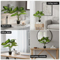 Go Hooked artificial Dieffenbachia plant with 12 green patterned leaves in a black speckled pot with white pebbles.