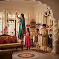 GoHooked white artificial mogra flower garlands with pink lotus buds, decorating a festive Indian home.