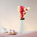 Go Hooked artificial flowers in red and yellow with a white textured vase, perfect for home and office decor.