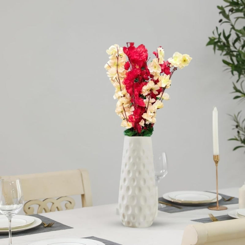 Go Hooked artificial flowers in red and yellow with a white textured vase, perfect for home or office decor.