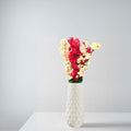 GoHooked yellow and red artificial flowers in a white textured vase. Realistic faux blossoms for home and office decor.