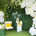 GoHooked artificial grass wall tiles create a lush green backdrop for a bridal shower with lemon and white balloon decor.