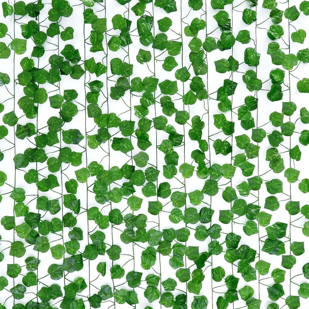 GoHooked pack of 12 green artificial Pilea coin leaf creepers, 7 ft each, realistic plastic vine for home decor.