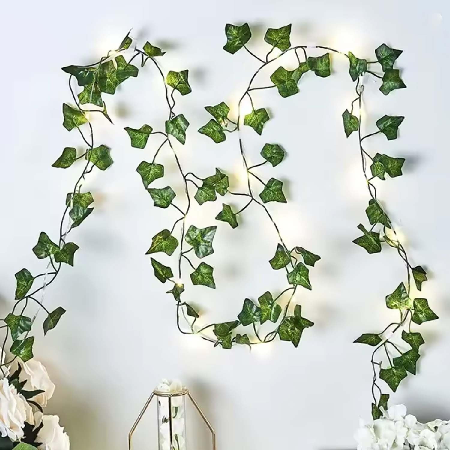 GoHooked artificial green ivy leaf garland with 72 leaves each, 7 ft long, featuring warm white LED lights for home decor.