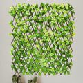 GoHooked artificial green ivy leaves on an expanding wooden trellis for home and garden wall decor.
