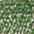GoHooked artificial ivy trellis with green leaves on a brown wooden lattice frame for indoor and outdoor garden decor.