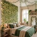 GoHooked artificial green linden leaf creeper garland with fairy lights decorating a bedroom wall and ceiling.