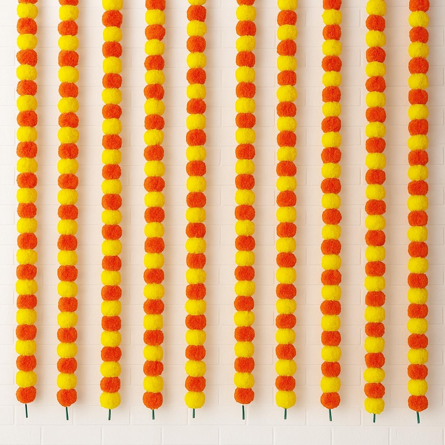GoHooked orange and yellow artificial marigold flower garlands for festive decoration. Fabric and plastic material.