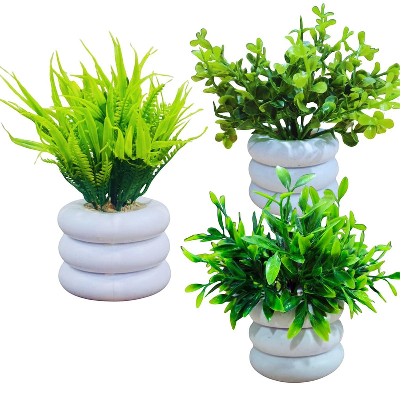 Go Hooked set of 3 artificial mini plants in white stacked pots. Assorted green foliage for home or office decor.