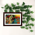 Go Hooked artificial green money plant garland with polyester leaves, 6 feet long, draped around a framed abstract painting.