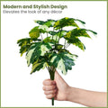GoHooked artificial Monstera Deliciosa plant with 18 variegated green and cream leaves, held by a hand.