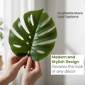GoHooked artificial monstera leaf with realistic green texture held by hands for modern home decor styling