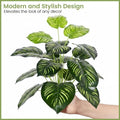 Go Hooked artificial plant with large dual-shade green leaves and textured patterns, displayed in a nursery pot.