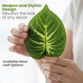 GoHooked artificial plant leaf with realistic green and yellow patterned veins held by a person for home decor