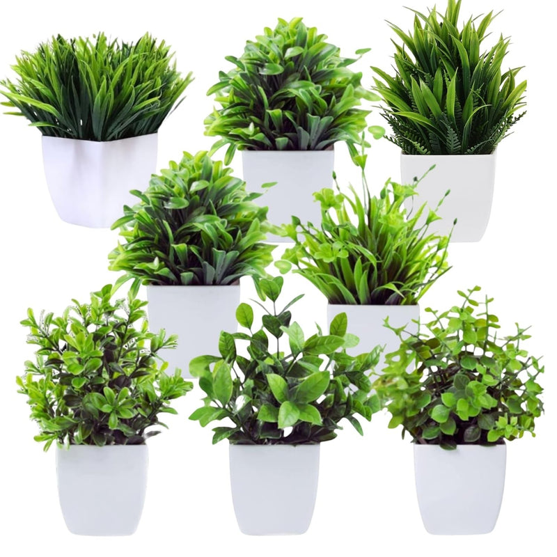 GoHooked set of 7 artificial green plants in white square pots, varying leaf shapes and sizes for home decor.